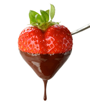 a heart shapped strawberry dipped in chocolate fondue