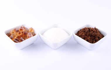 Sugar: brown, white and brown rock candy in bowls