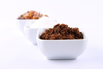 Sugar: brown, white and brown rock candy in bowls