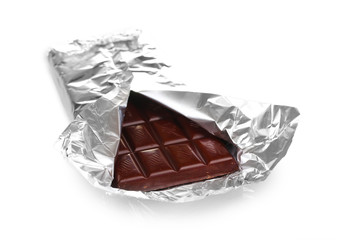 Сhocolate bar in an open silver package isolated on white