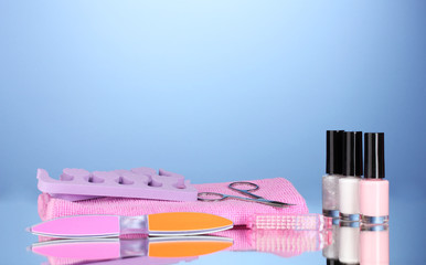 Pedicure set on blue background