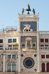 Tower with Astronomical clock and Lion statue. Venice, Italy.