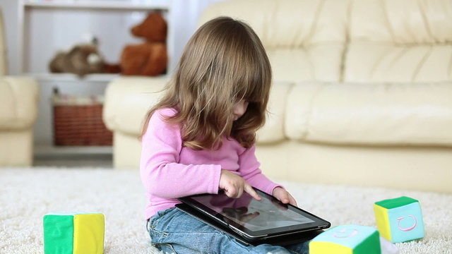 Baby girl with tablet PC