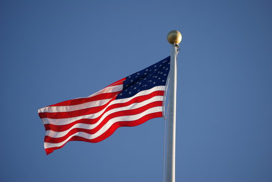 American flag waving in the sun