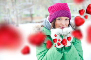 Happy girl thinking of love and having fun outdoors in winter