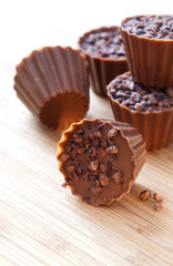 Chocolate candies on a wooden background