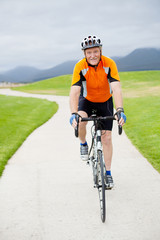 active senior man riding road bicycle