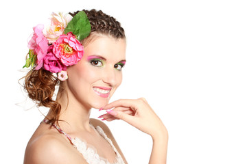 Obraz na płótnie Canvas Beautiful girl with flowers in her hair isolated on white