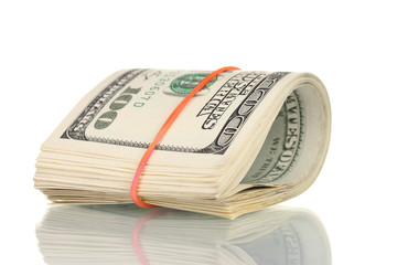 A lot of one hundred dollar bills tied rubber band isolated