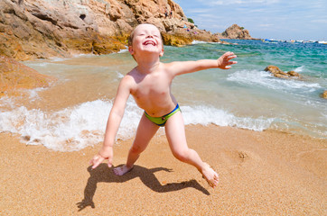 playing on a sea coast