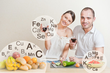 Young lovely couple cooking a balanced diet. Big copyspace. Vita