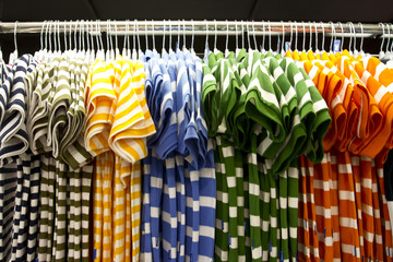 shirt row, colorful shirt arrange in a row in mall.