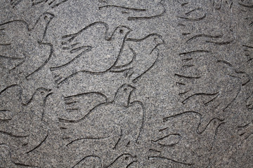 Peace dove representation in a low relief