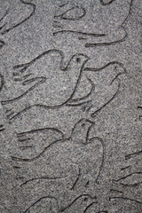 Peace dove representation in a low relief