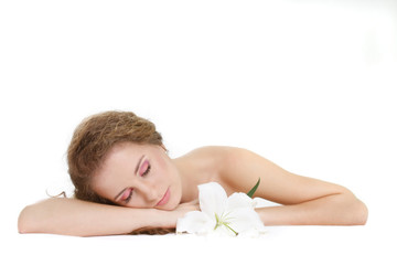 Obraz na płótnie Canvas young beautiful woman sleeping over white