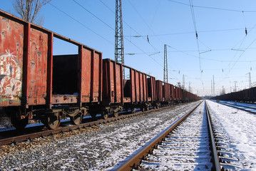 Fototapeta na wymiar Abandoned freight wagons, railway lines in perspective