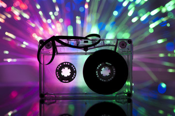Fototapeta na wymiar Cassette tape and multicolored lights
