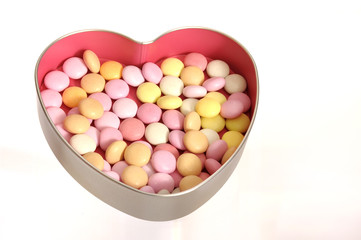 sweets in an open silver heart shaped box