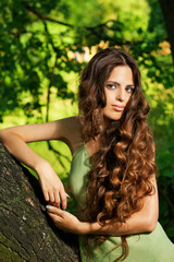 Portrait of beautiful woman with long curly hair