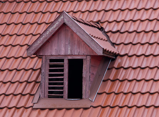 squint window on red roof