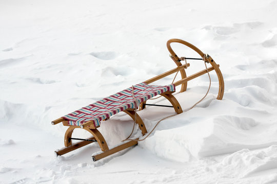 wooden sledge on snow