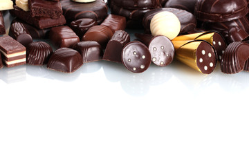Many different chocolate candy isolated on white