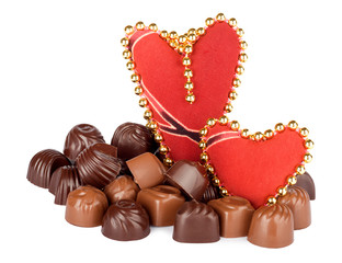 Delicious chocolate and two hearts on the white background isola