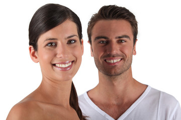 Attractive couple stood in studio