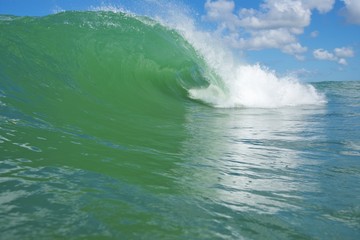 perfect green slab barrel wave breaking outer reef 2