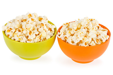 Fototapeta na wymiar Popcorn in orange and green bowl on a white background
