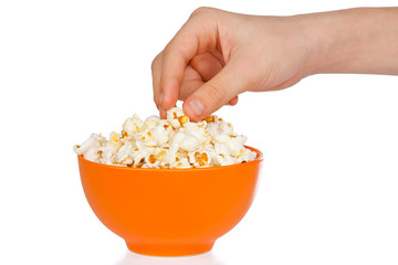 Hand a teenager with popcorn on a white background