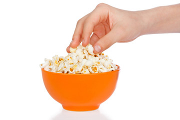 Hand a teenager with popcorn on a white background