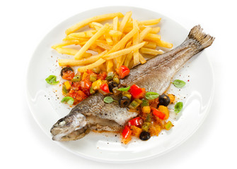 Fish dish - roast trout and vegetables on white background