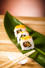 sushi rolls with chopsticks