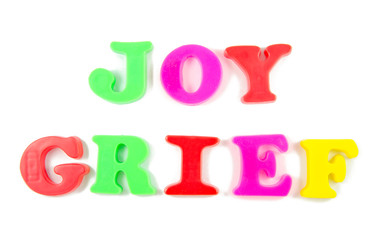 joy and grief written in fridge magnets