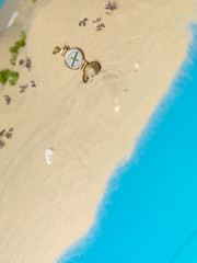 golden compass in sand, miniature landscape