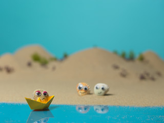 Fototapeta na wymiar funny sea shells in a miniature landscape