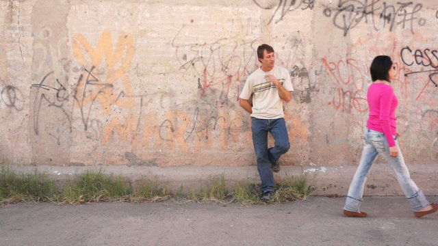 Perverted Guy Looking Up a Woman as She Walks By..