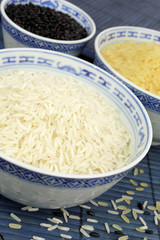 Three types of rice in white bowls
