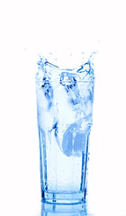 Fototapeta na wymiar Water splash in glasses isolated on white