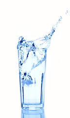 Water splash in glasses isolated on white