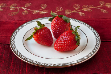 Three Strawberries on a Plate