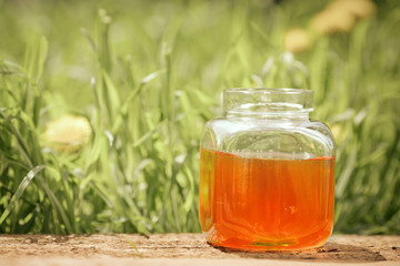 Flowery honey in glass jar