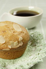 almond muffin and cup of coffee