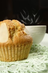 almond muffin and cup of hot coffee