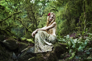 Portrait of romantic woman in fairy forest