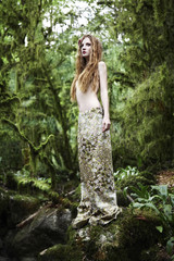 Portrait of romantic woman in fairy forest