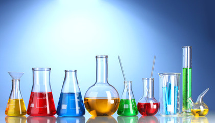 Different laboratory glassware with color liquid and with