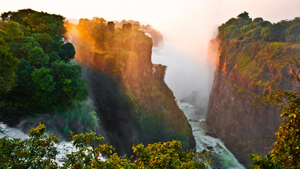 The Victoria Falls at the border of Zimbabwe and Zambia - obrazy, fototapety, plakaty