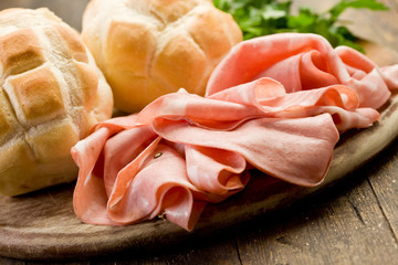 Mortadella with Bread on Chopping board © Francesco83